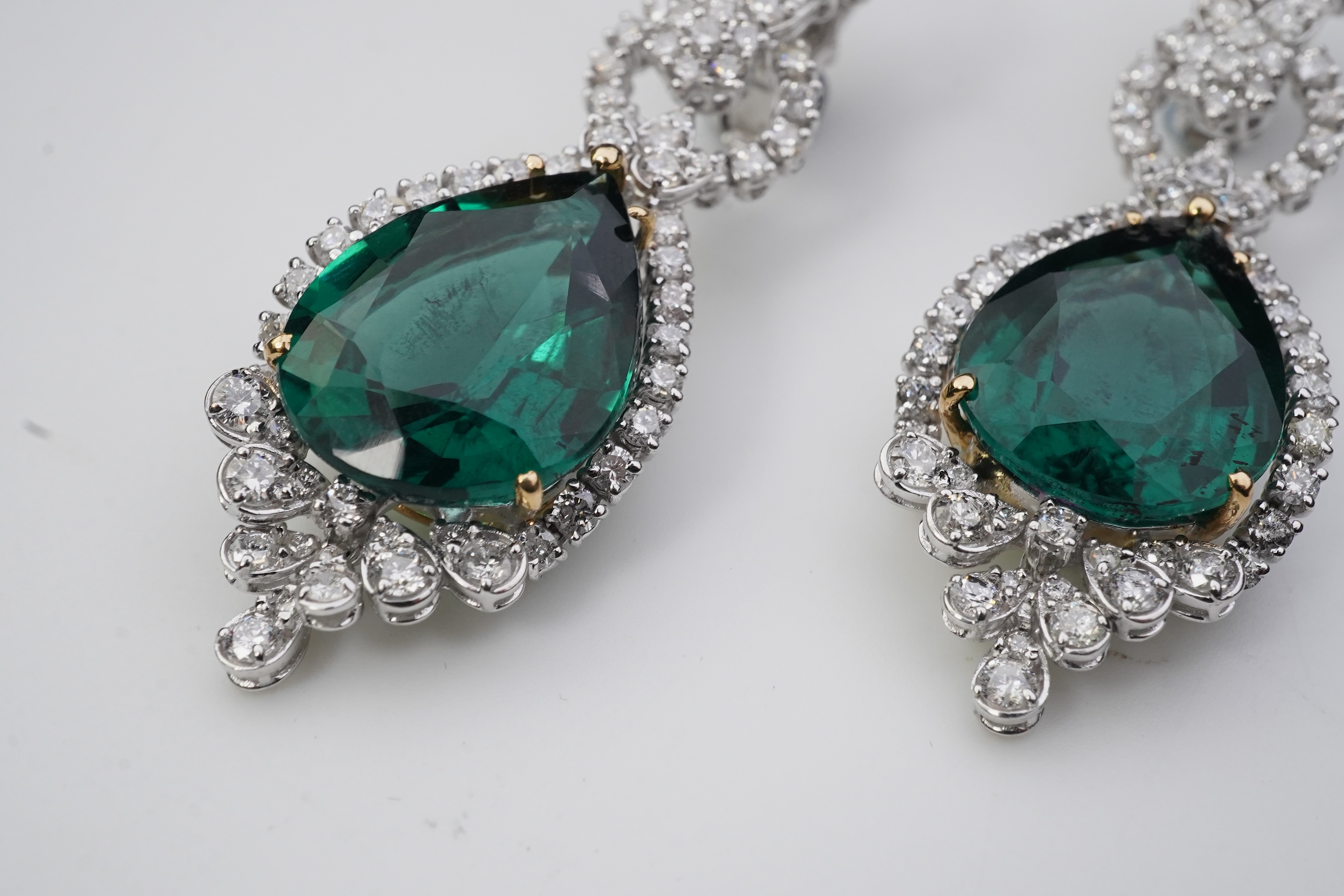 A pair of synthetic green quartz and diamond earrings